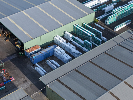 Melbourne Australia 22 September 2026 Aerial view of industrial warehouses and storage yards with stacked building materials and shipping containers in Kilsyth Melbourne. Melbourne Australia 22 September 2026 Aerial view of industrial warehouses and storage yards with stacked building materials and shipping containers in Kilsyth Melbourne.