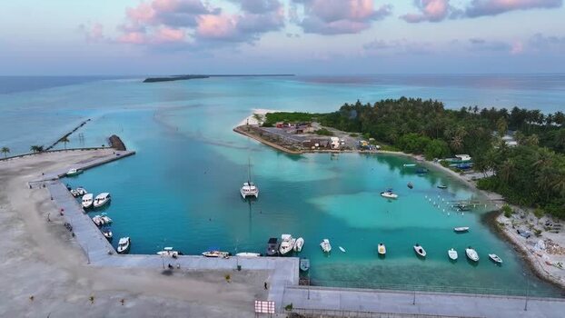 Aerial view of boats in a tropical harbor in Fulhadhoo Maldives.