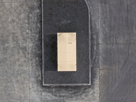 Aerial view of a rectangular industrial utility unit situated on a concrete surface within an industrial site in Melbourne VIC Australia.