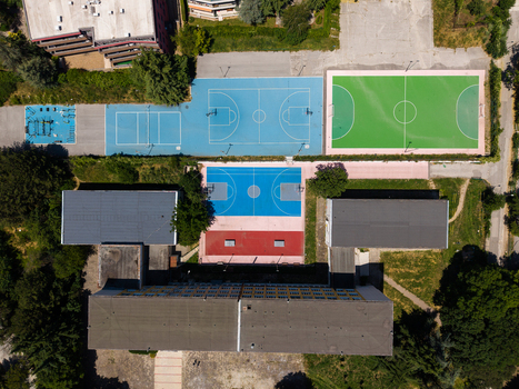 Aerial view of the Fourth Foreign Language School Frederic Joliot Curie featuring colorful sports courts and school buildings in Varna Varna Bulgaria. Aerial view of the Fourth Foreign Language School Frederic Joliot Curie featuring colorful sports courts and school buildings in Varna Varna Bulgaria.