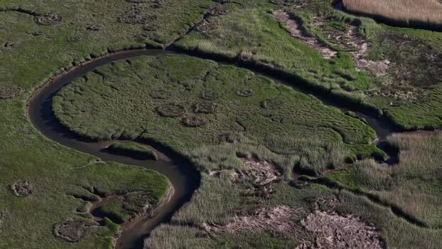 Aerial view of marshland and winding river Portugal. Aerial view of marshland and winding river Portugal.