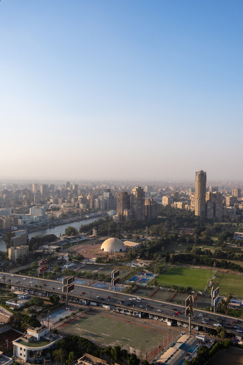 Aerial view of the cityscape with the tall Cairo Tower and a river flowing through the urban landscape Cairo Egypt. Aerial view of the cityscape with the tall Cairo Tower and a river flowing through the urban landscape Cairo Egypt.