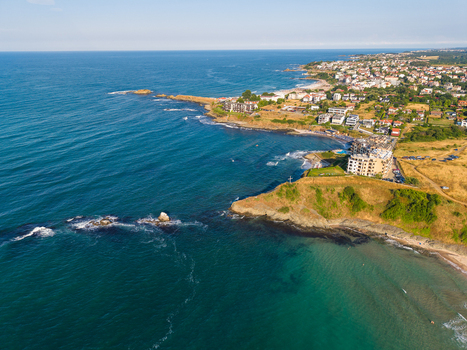 Aerial view of Lozenets Northern Cross on the rocky coastline with coastal buildings turquoise sea and sandy beaches Lozenets Burgas Bulgaria. Aerial view of Lozenets Northern Cross on the rocky coastline with coastal buildings turquoise sea and sandy beaches Lozenets Burgas Bulgaria.