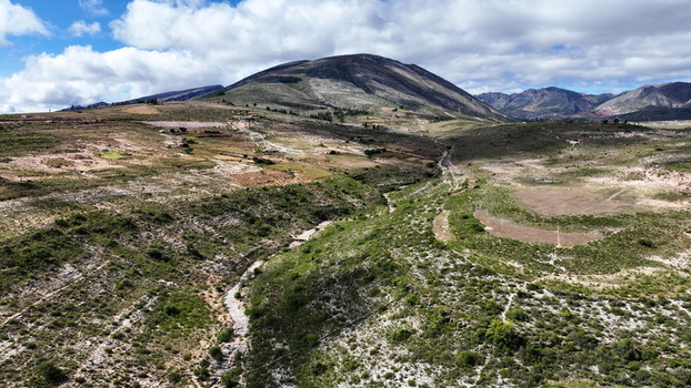 Aerial view of the rugged landscape and canyon at El Vergel with green vegetation and mountains under a cloudy sky in Torotoro Potosi Department Bolivia. Aerial view of the rugged landscape and canyon at El Vergel with green vegetation and mountains under a cloudy sky in Torotoro Potosi Department Bolivia.