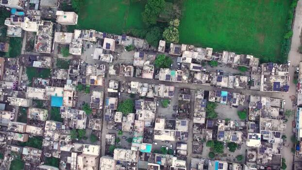Aerial view of solar panels on residential rooftops India.