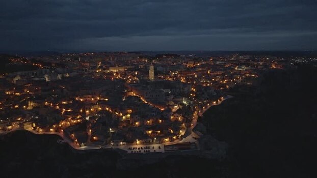 Aerial view of illuminated Matera at night Italy.