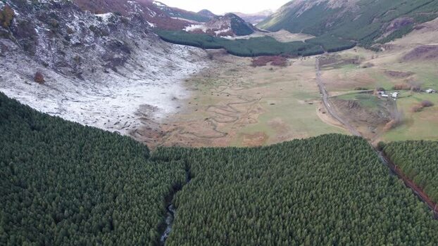 Aerial view of winding river and snow capped mountains in Chile. Aerial view of winding river and snow capped mountains in Chile.