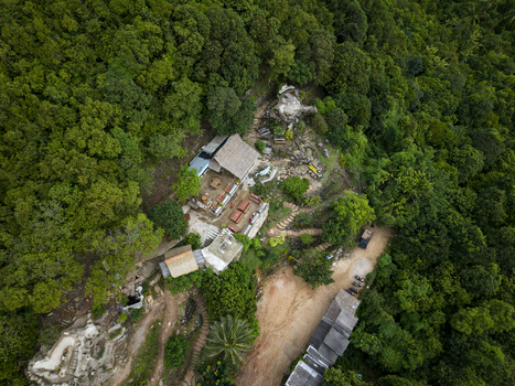 Aerial view of buildings nestled among lush green trees Bukit Love Karimunjawa Jawa Tengah Indonesia. Aerial view of buildings nestled among lush green trees Bukit Love Karimunjawa Jawa Tengah Indonesia.