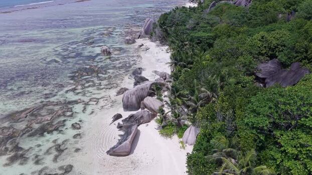 Aerial view of Anse Reunion beach with granite boulders Seychelles.