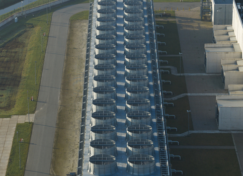 Aerial view of the nitrogen plant featuring rows of large industrial cooling fans and concrete structures under soft daylight in Zuidbroek Groningen Netherlands. Aerial view of the nitrogen plant featuring rows of large industrial cooling fans and concrete structures under soft daylight in Zuidbroek Groningen Netherlands.