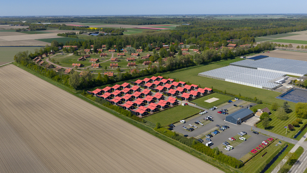 Drone view of AZC Luttelgeest in the Netherlands showing a reception centre for asylum seekers temporary housing community facilities and social infrastructure. Drone view of AZC Luttelgeest in the Netherlands showing a reception centre for asylum seekers temporary housing community facilities and social infrastructure.