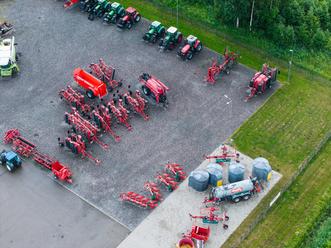 Brankas Latvia 04 July 2026 Aerial view of a modern agricultural machinery sales and service center featuring rows of tractors farm equipment and storage tanks on a gravel yard. Brankas Latvia 04 July 2026 Aerial view of a modern agricultural machinery sales and service center featuring rows of tractors farm equipment and storage tanks on a gravel yard.