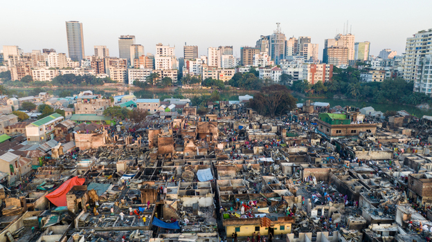 Aerial view of destroyed buildings contrasting with the modern skyline in the distance a scene of devastation Dhaka Dhaka Division Bangladesh. Aerial view of destroyed buildings contrasting with the modern skyline in the distance a scene of devastation Dhaka Dhaka Division Bangladesh.