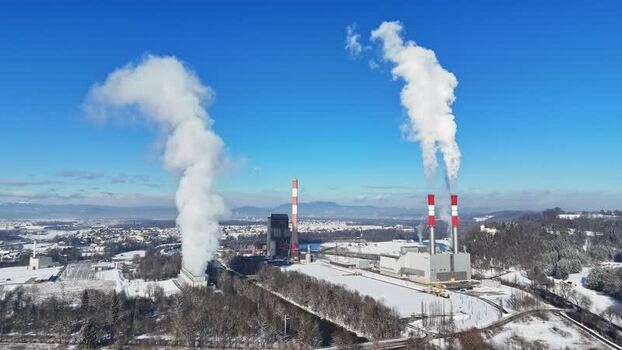 Aerial view of a power plant with smoking chimneys Austria.