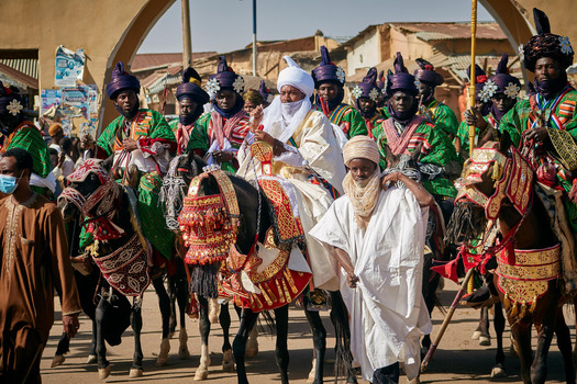 Zaria City Nigeria 21 March 2026 View of a vibrant procession of elaborately dressed horsemen in contrasting green and white parading proudly. Zaria City Nigeria 21 March 2026 View of a vibrant procession of elaborately dressed horsemen in contrasting green and white parading proudly.