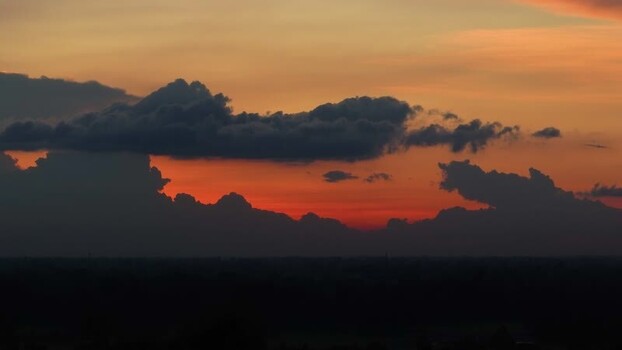 View of dramatic sunset clouds over the horizon Bangladesh.