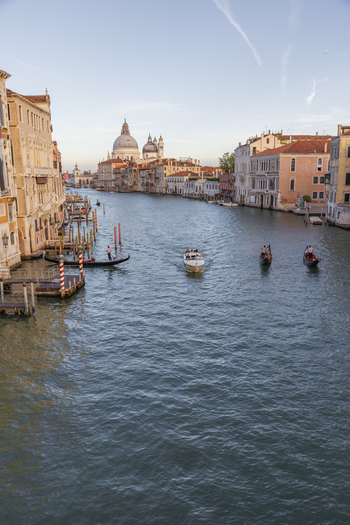 Venice Italy 21 September 2026 View of the Grand Canal with the Santa Maria della Salute basilica in the background featuring gondolas and motorboats navigating the water. Venice Italy 21 September 2026 View of the Grand Canal with the Santa Maria della Salute basilica in the background featuring gondolas and motorboats navigating the water.