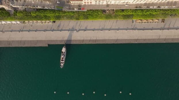 Aerial view of the Island of Ortigia waterfront with a boat Italy.