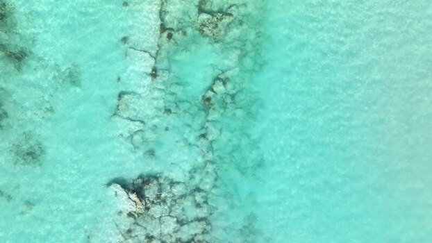 Aerial view of a coral reef in clear turquoise water Maldives. Aerial view of a coral reef in clear turquoise water Maldives.