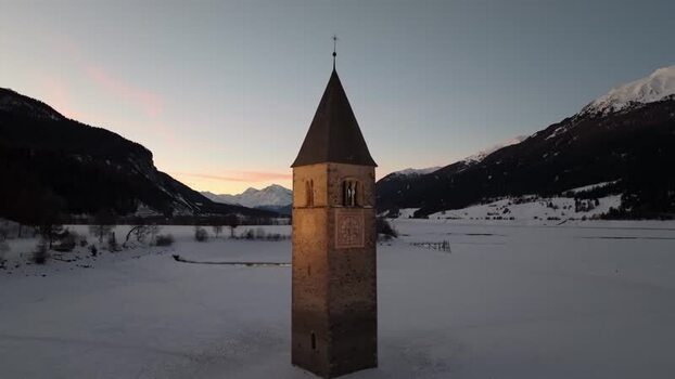 Aerial view of the historic sunken bell tower in Graun im Vinschgau Italy. Aerial view of the historic sunken bell tower in Graun im Vinschgau Italy.