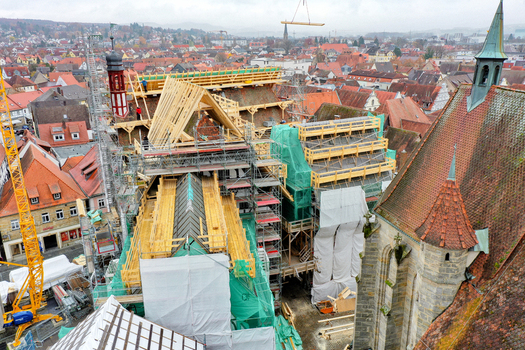 Aerial view of Rathaus Forchheim under renovation with extensive scaffolding and wooden roof structures overlooking the historic old town Forchheim Bayern Germany. Aerial view of Rathaus Forchheim under renovation with extensive scaffolding and wooden roof structures overlooking the historic old town Forchheim Bayern Germany.