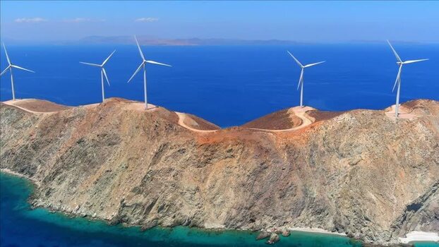 Aerial view of wind turbines on a rocky island Greece. Aerial view of wind turbines on a rocky island Greece.