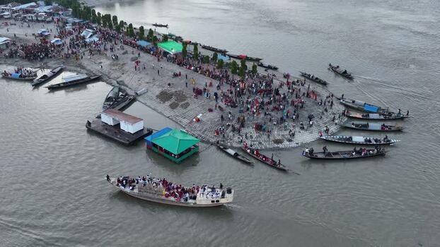 Aerial view of a crowded riverbank with boats in Bogura Bangladesh.