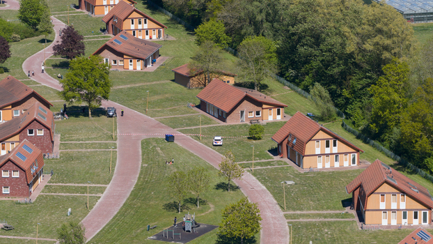 Drone view of AZC Luttelgeest in the Netherlands showing a reception centre for asylum seekers temporary housing community facilities and social infrastructure. Drone view of AZC Luttelgeest in the Netherlands showing a reception centre for asylum seekers temporary housing community facilities and social infrastructure.