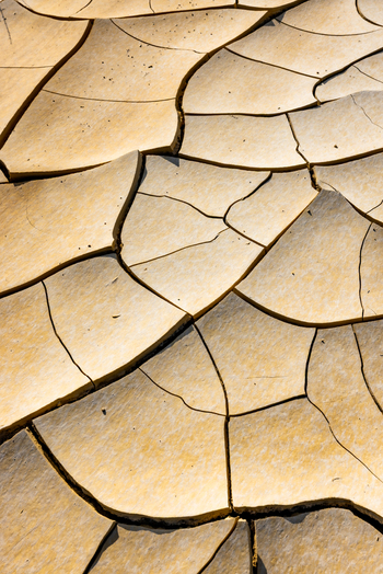 Aerial view of the cracked dry earth patterns of the Tuzbair salt flats in the desert landscape Mangystau District Mangystau Region Kazakhstan.