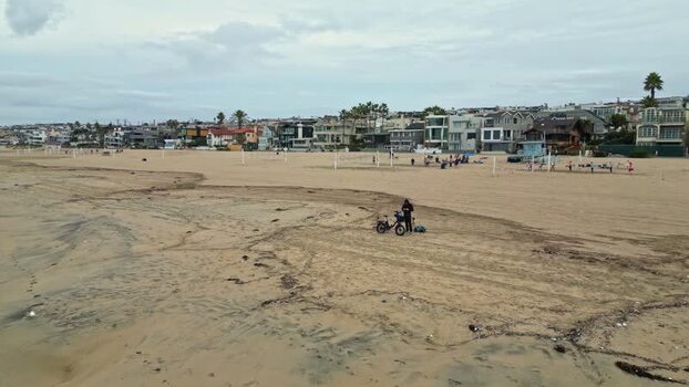 Aerial view of a person with an e bike on the beach United States.