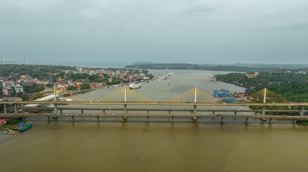 Aerial view of Atal Setu bridge spanning the Mandovi River with the cityscape of Panaji Goa India.