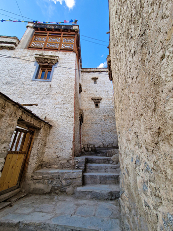 View of the historic stone staircase and traditional white washed walls of Leh Palace in Leh Ladakh India.