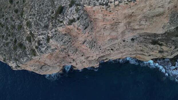 Aerial view of rugged coastal cliffs in Moraira Spain.