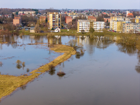 Aerial view of flooded fields and meadows near residential apartment buildings in Kedainiai Kaunas County Lithuania. Aerial view of flooded fields and meadows near residential apartment buildings in Kedainiai Kaunas County Lithuania.