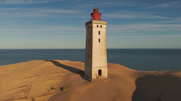 Aerial view of Rubjerg Knude lighthouse on sand dunes Denmark.