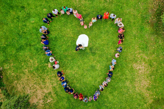 Wiesenthau Germany 02 May 2026 Aerial view of wedding guests forming a heart shape around a bride and groom on the green lawn of Schloss Wiesenthau. Wiesenthau Germany 02 May 2026 Aerial view of wedding guests forming a heart shape around a bride and groom on the green lawn of Schloss Wiesenthau.