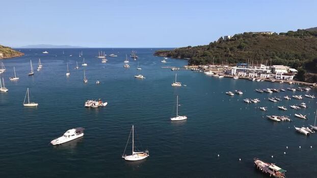 Aerial view of Naregno Beach with boats in the bay Italy.
