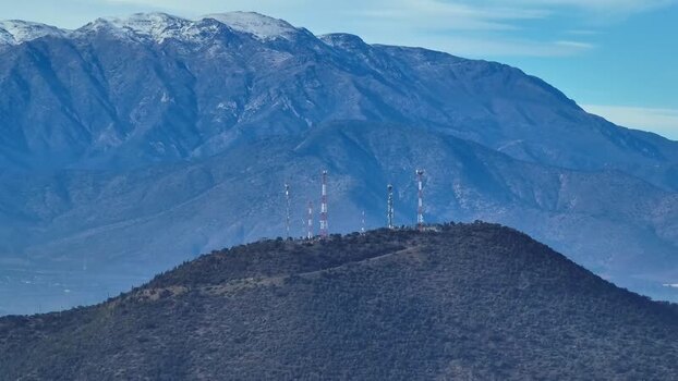Aerial view of communication towers on a hill in Chile.