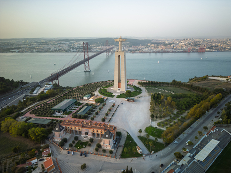 Aerial view of the Cristo Rei statue overlooking the Tagus River and the 25 de Abril Bridge in Lisbon Lisbon Portugal. Aerial view of the Cristo Rei statue overlooking the Tagus River and the 25 de Abril Bridge in Lisbon Lisbon Portugal.