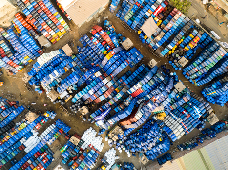 Aerial view of thousands of colorful plastic barrels and industrial drums stacked in an outdoor storage yard Dhaka Dhaka Division Bangladesh. Aerial view of thousands of colorful plastic barrels and industrial drums stacked in an outdoor storage yard Dhaka Dhaka Division Bangladesh.