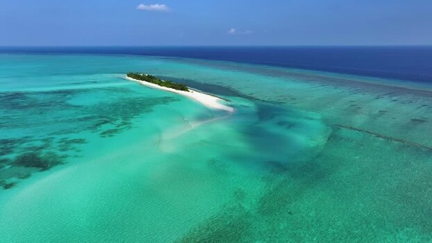Aerial view of Fulhadhoo island and coral reefs Maldives.