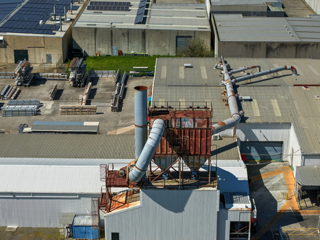 Kilsyth Australia 20 September 2026 Aerial view of an industrial factory complex featuring large metal ventilation ducts machinery and solar panels on rooftops. Kilsyth Australia 20 September 2026 Aerial view of an industrial factory complex featuring large metal ventilation ducts machinery and solar panels on rooftops.
