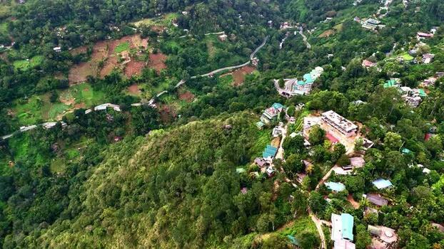 Aerial view of mountainous landscape and buildings in Sri Lanka.