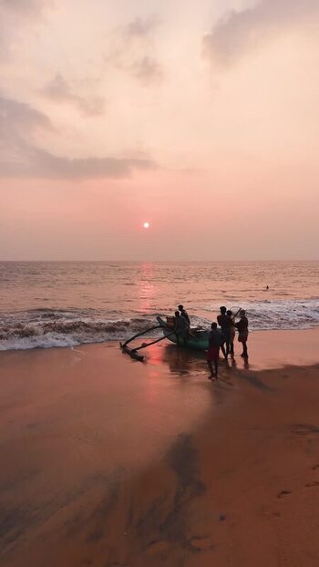 Aerial view of fishermen with a boat on the beach Sri Lanka.
