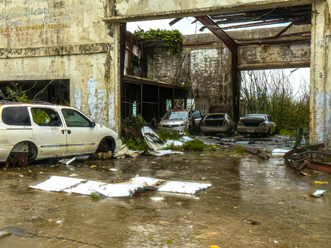 San Jose Tinian Northern Mariana Islands 06 July 2026 View of storm damaged industrial building with debris and abandoned vehicles during Super Typhoon Bavi. San Jose Tinian Northern Mariana Islands 06 July 2026 View of storm damaged industrial building with debris and abandoned vehicles during Super Typhoon Bavi.