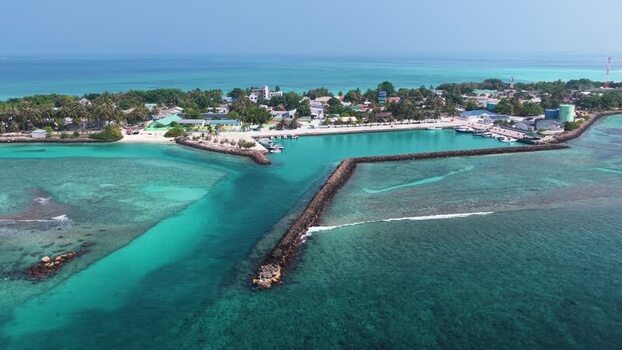 Aerial view of the harbor and turquoise lagoon Maldives. Aerial view of the harbor and turquoise lagoon Maldives.