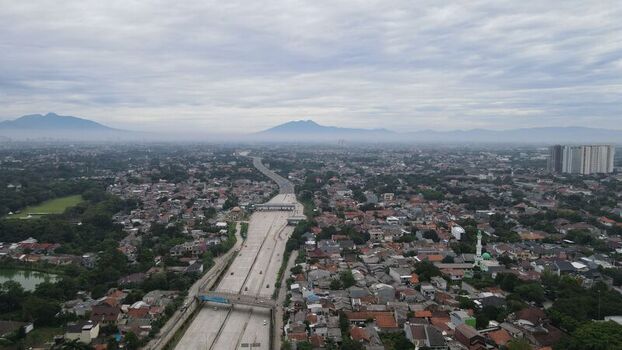 Aerial view of Jalan Tol Depok Antasari highway cutting through the dense urban landscape of Kecamatan Cilandak Daerah Khusus Ibukota Indonesia. Aerial view of Jalan Tol Depok Antasari highway cutting through the dense urban landscape of Kecamatan Cilandak Daerah Khusus Ibukota Indonesia.