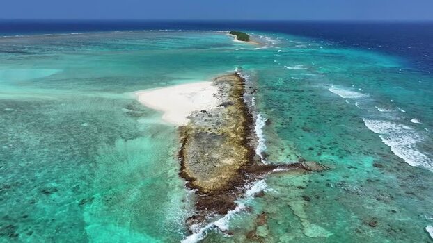 Aerial view of a tropical sandbar and coral reef Maldives. Aerial view of a tropical sandbar and coral reef Maldives.