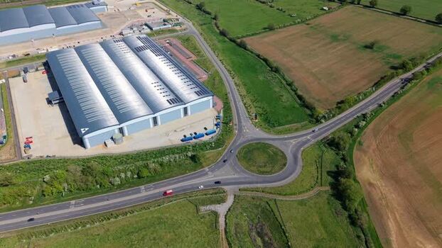 Aerial view of Symmetry Park warehouses and roads United Kingdom. Aerial view of Symmetry Park warehouses and roads United Kingdom.
