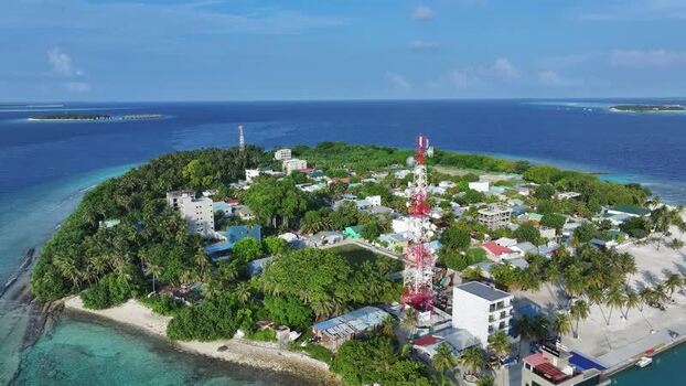 Aerial view of Kamadhoo island with its communication tower Maldives. Aerial view of Kamadhoo island with its communication tower Maldives.